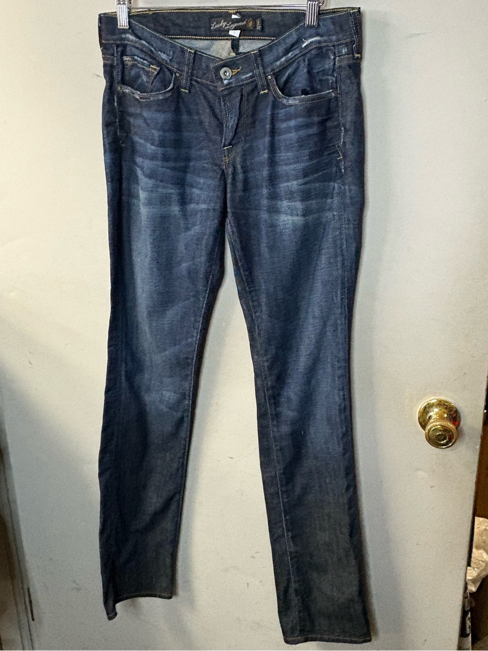 Lucky Legend  size 6 Dark Blue slightly distressed, mid rise straight leg jeans